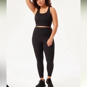 Girlfriend Collective workout set in black. Small bra, Medium leggings.